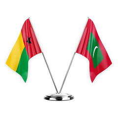 Two table flags isolated on white background 3d illustration, guinea-bissau and maldives