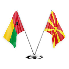 Two table flags isolated on white background 3d illustration, guinea-bissau and north macedonia