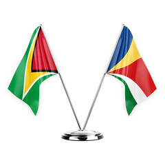 Two table flags isolated on white background 3d illustration, guyana and seychelles