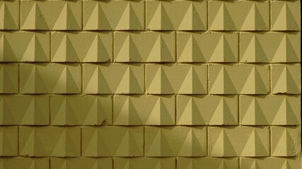 yellow wall background of geometric bricks