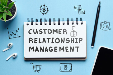 Concept CRM or Customer Relationship Management. The inscription in the notebook.