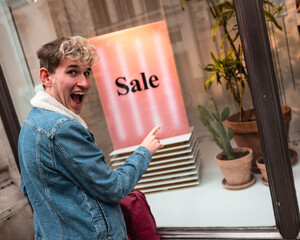 person with a sale sign
