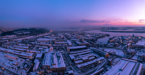 Obraz premium Aerial view of the industrial area of the city at dawn.