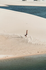 Lençóis Maranhenses - Silhouette of a girl doing handstands in the dunes of this brazilian national park