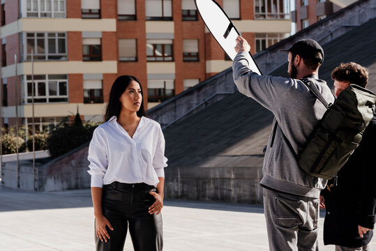 Young Latina model woman posing during a fashion themed photo shooting outdoors