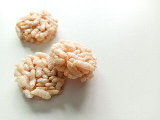 Thai sweets are arranged on white paper background. Thai fried sweet rice. Thai dressert concept.