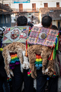 Back view of two men with Mexican style backpacks