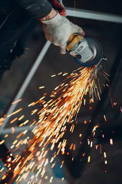 Cropped image of a hand welding a frame