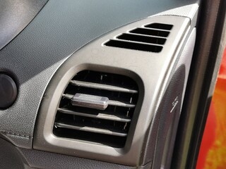 Close up interior view of the car air conditioning vent.