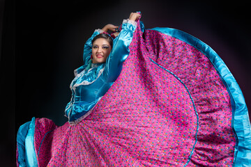 Mexican woman in Chiapas dress dancing