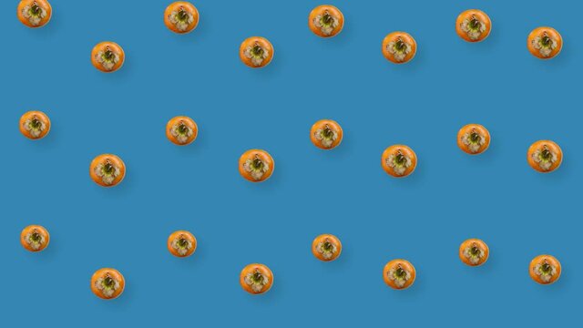 Colorful pattern of fresh orange persimmons. Top view. Seamless pattern with persimmon. Pop art design. Realistic animation. 4K video motion