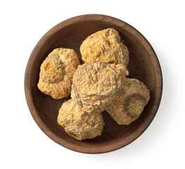 Dried yellow Maca in the wooden bowl, isolated on white background, top view