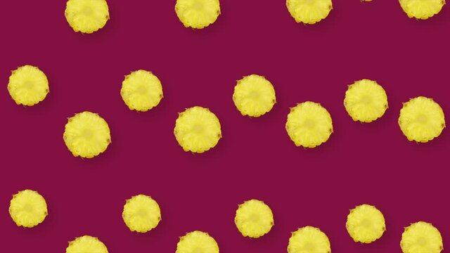Colorful fruit pattern of fresh pineapple. Seamless pattern with pineapple sliced. Realistic animation. 4K video motion