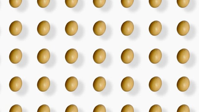 Colorful pattern of chicken eggs. Seamless pattern with egg. Top view. Realistic animation. 4K video motion