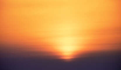 Bright warm sun on sky background. Dawn or sunset.