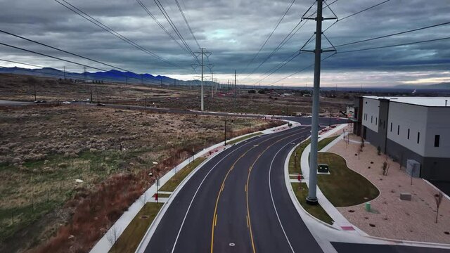 Incredible Aerial Shot Going between Power Lines at Bringhurst Station and Redwood Road Street in Bluffdale Utah. Forward and Rising Up