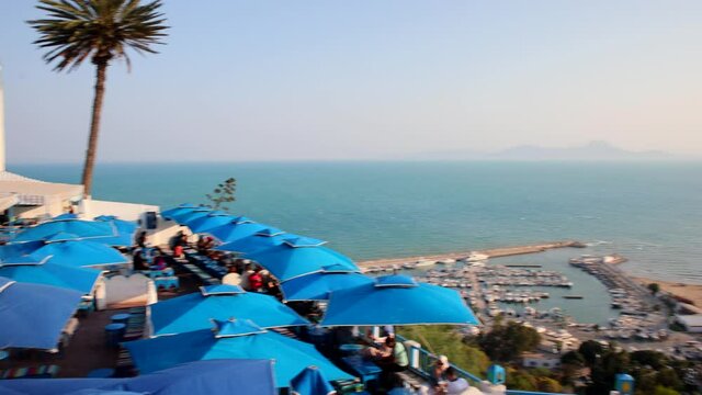 Panning Through Commercial Port And Cafe des Delices On Sidi Bou Said In Mediterranean Sea, Northern Tunis, Tunisia.
