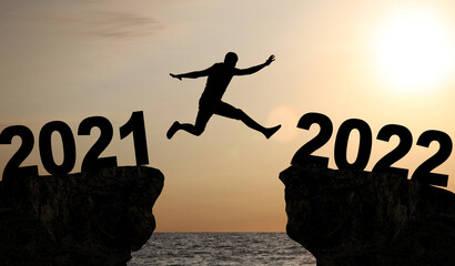 Happy New Year Background. Successful jump to the year 2022.