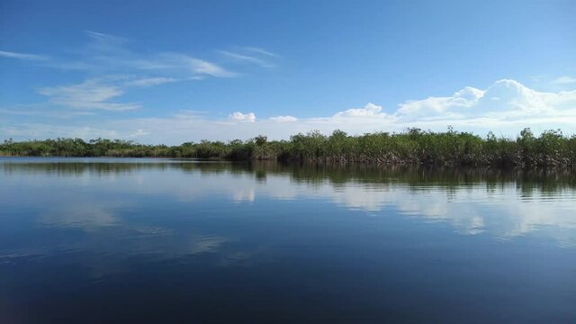 Afternoon kayaking on Nine Mile Pond in Everglades National Park, Florida on calm sunny winter day 4K.