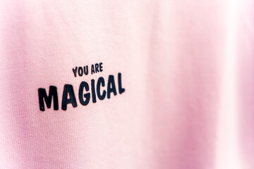 You Are Magical writing on pink clothes at the mall