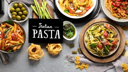 Pasta assortment on gray background.