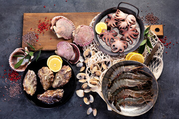 Fresh seafood arrangement on dark background.