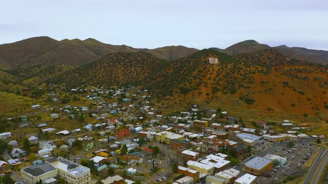Bisbee Arizona rooftops and skyline, wide angle drone backwards