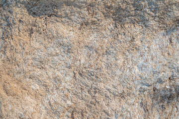 Detail of stone texture for background. Surface of the marble with brown tint
