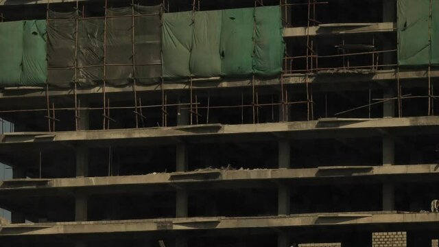 Sheeting Covering Construction Building. Slow Zoom Out