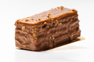 Chocolate rectangular sponge cake on white background