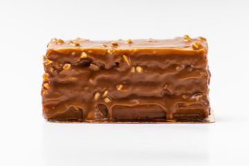 Chocolate rectangular sponge cake on white background