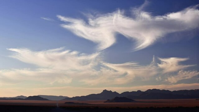  Moutain range outside of the Namib Desert with r blue sky with beautiful white clouds. world Natural Heritage Site