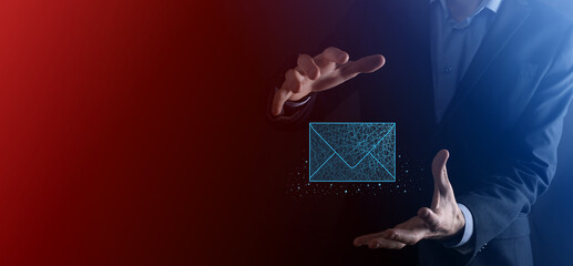 Businessman hand holding letter icon,email icons.Contact us by newsletter email and protect your...