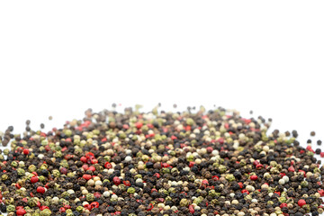Mixed peppercorns background. Different colored peppercorns, close up.