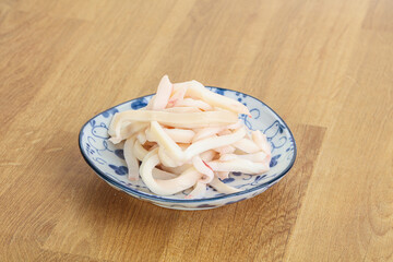 Marinated squid strips in the bowl