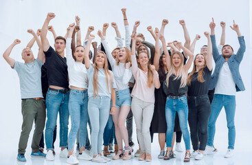 Fototapeta premium happy group of young people with hands up