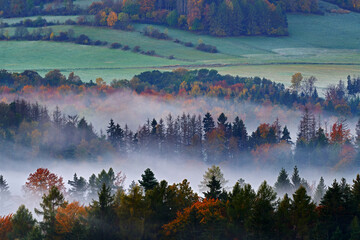 Czech typical autumn landscape. Hills and forest with foggy morning. Morning fall valley of...