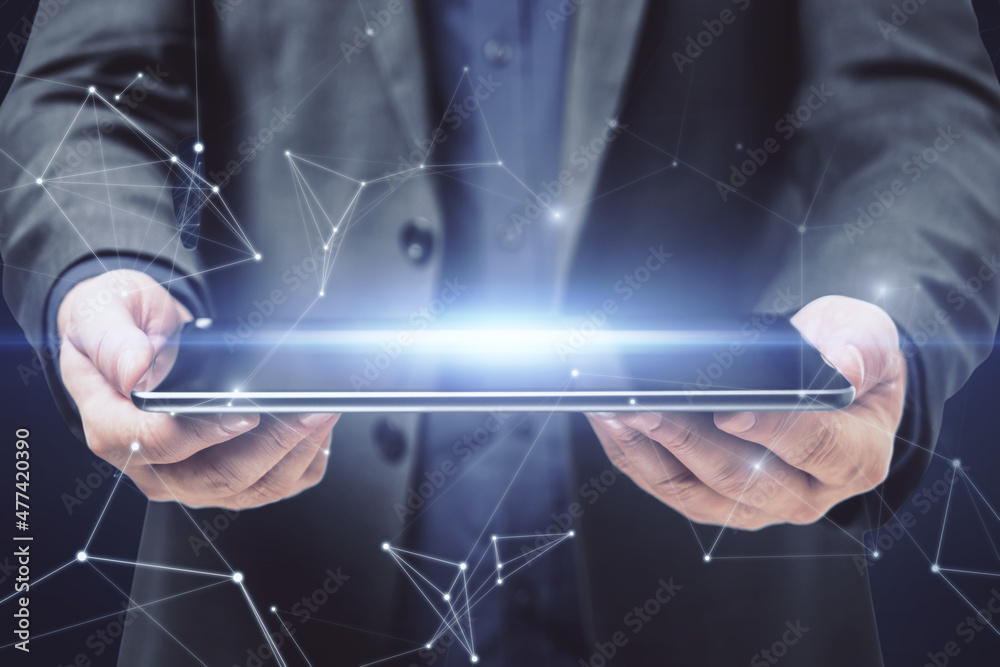 Poster close up of businessman hands holding tablet with abstract polygonal mesh. technology, communication