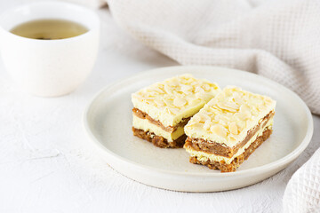 Pieces of sliced ​​lemon cake with almonds on the table. Sugar, gluten and lactose free and vegan.
