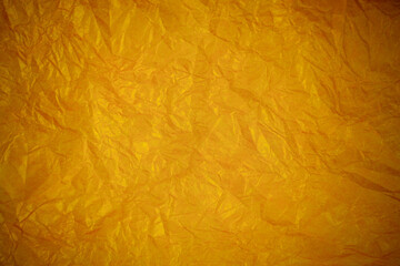 Obraz premium Crumpled gold paper recycling background.