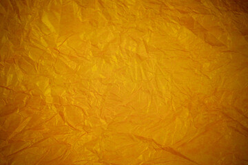 Crumpled gold paper recycling background.