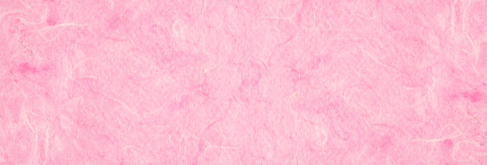 background of light pink, textured, handmade mulberry pape.