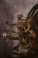 Obraz premium Antique cinema projector on neutral background with copy space.