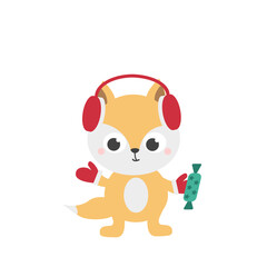 A cute red fox cub in red headphones and mittens holds a green chocolate candy. Christmas cute character. Merry Christmas. Vector illustration.