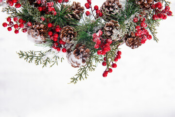 Half of christmas advent wreath with viburnum at the top on white background