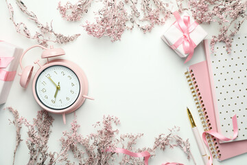 "Hello spring" concept with pink accessories on white background
