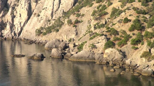View of  rocks and boulders along coast of Royal Beach closed to waves and prying eyes. Galitsyn trail. Close-up. Calm life in Crimea afte return of peninsula to native harbor. New Ligh. Crimea 2014.
