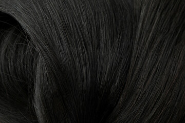 Brunette female hair on whole background, close up