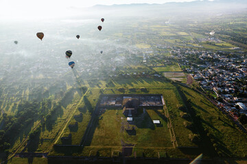 Hot Air Balloon Flight over Teotihuacan at sunrise in  Mexico. View from the top.