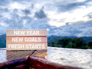 Motivational and Inspirational Concept - New year new goals fresh starts text background. Stock...